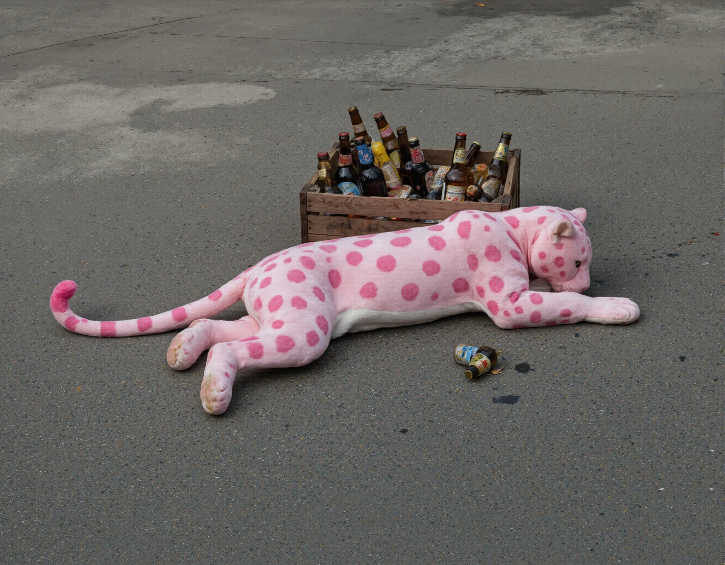 Pink Leopard Plush Resting Beside a Crate of Beer Bottles #40661