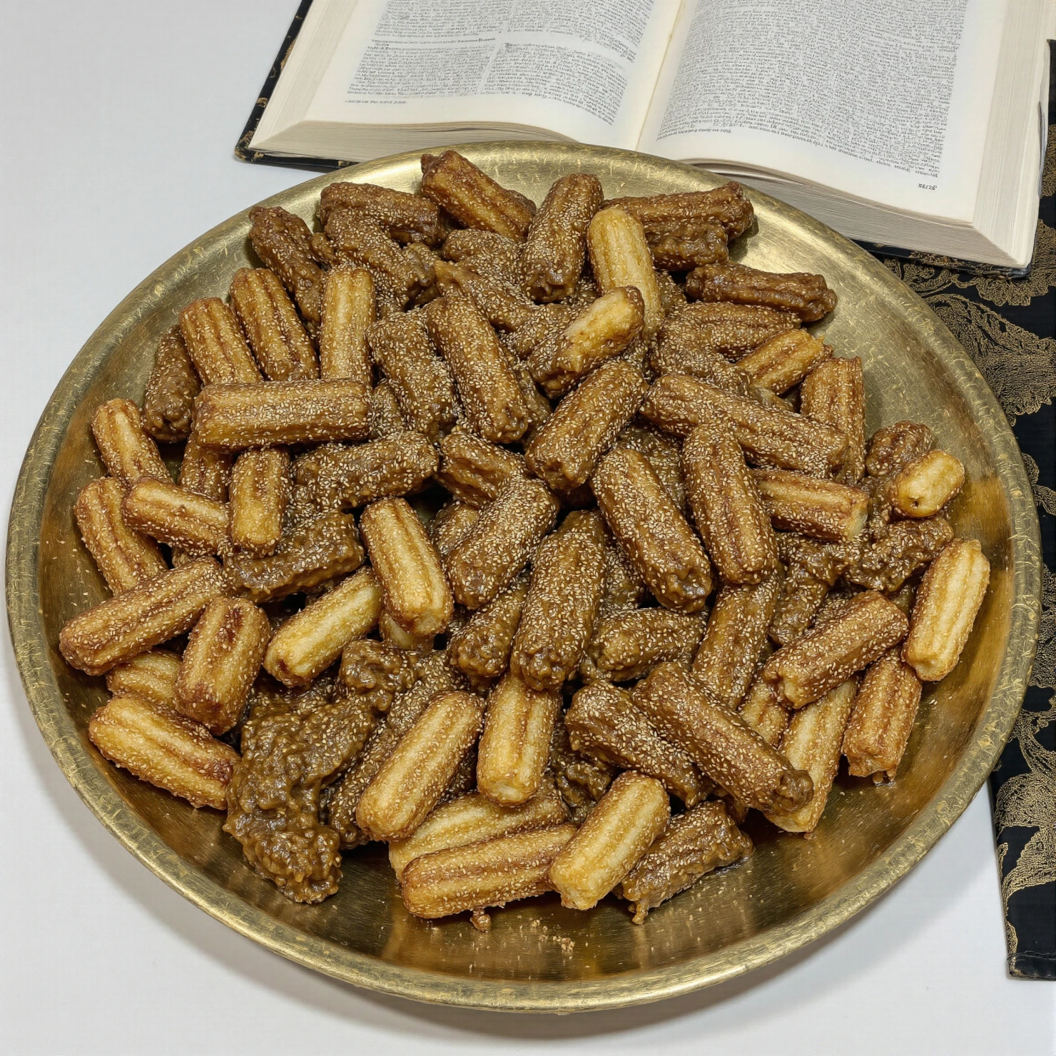 A Platter of Delicious Cinnamon Sugar Churro Bites with a Book in the Background #40777