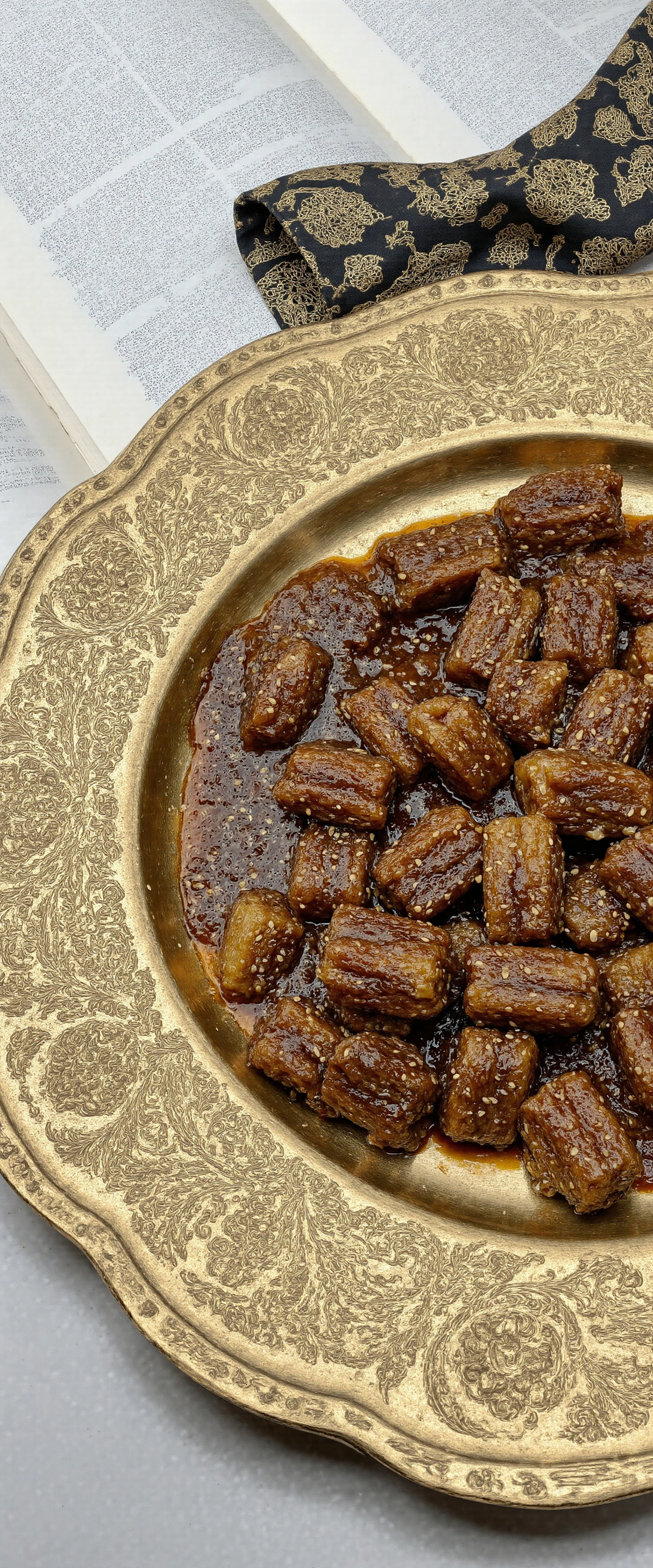 Caramelized Sesame Bites on a Decorative Gold Dish #40783
