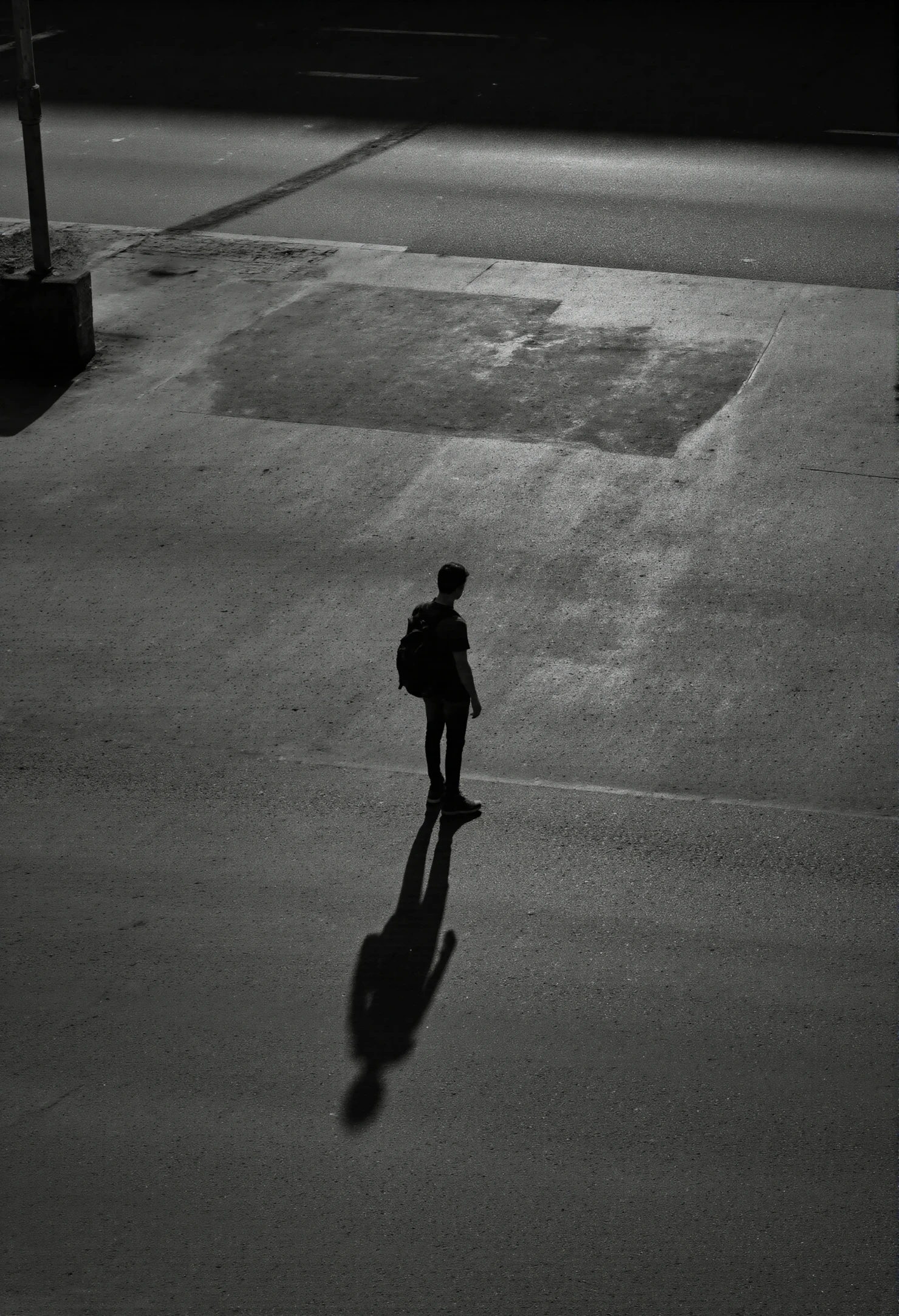 Solitary Figure and Long Shadow on a Dark Street #40834