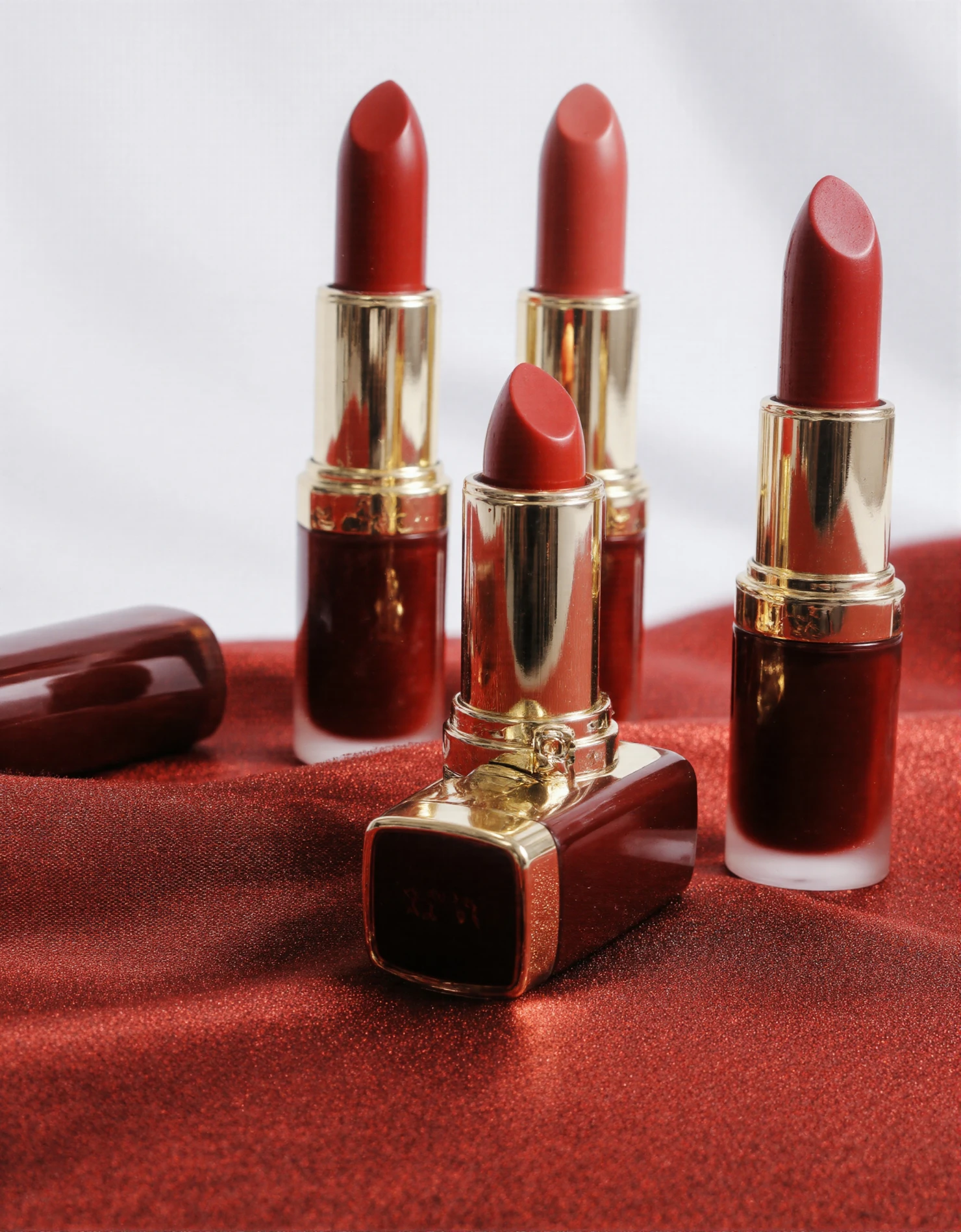 Luxurious Red Lipsticks on Elegant Satin Fabric #40865