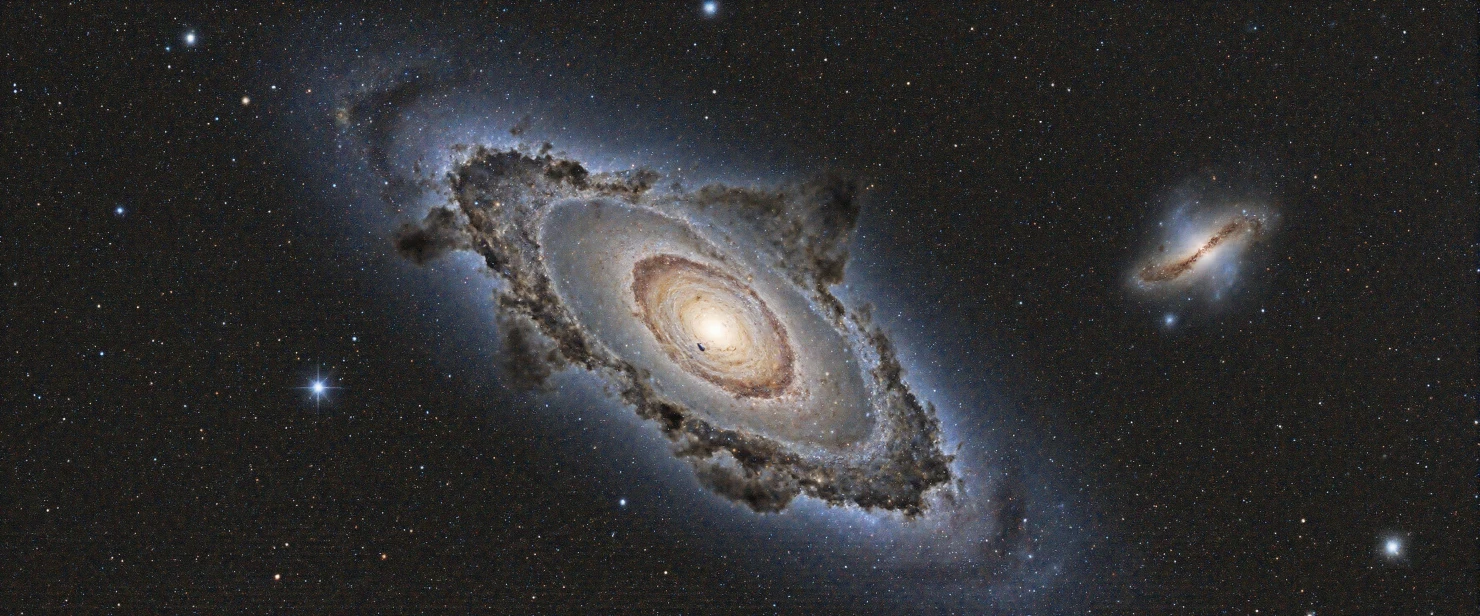 Andromeda Galaxy and its Companion in the Cosmic Expanse #40878
