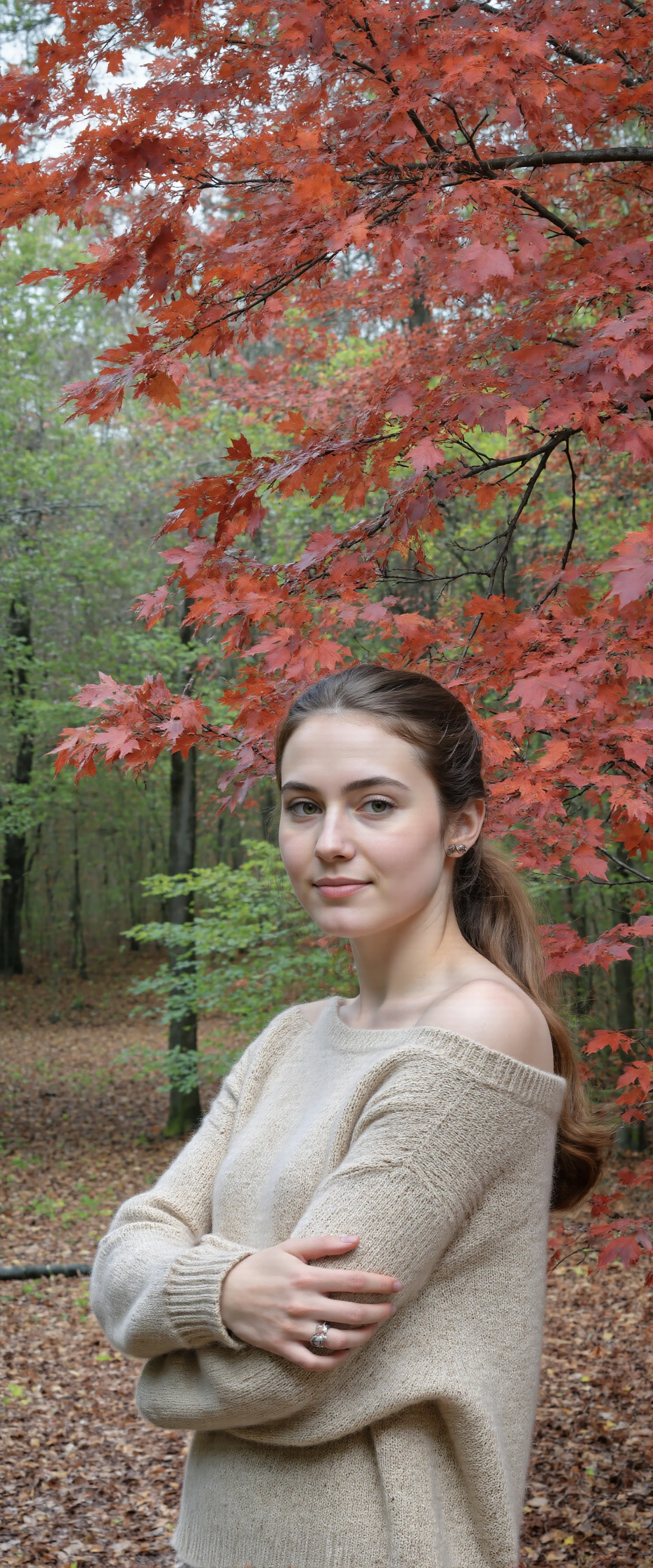 Portrait of a Woman in a Beige Sweater Amidst Vibrant Autumn Foliage #40879