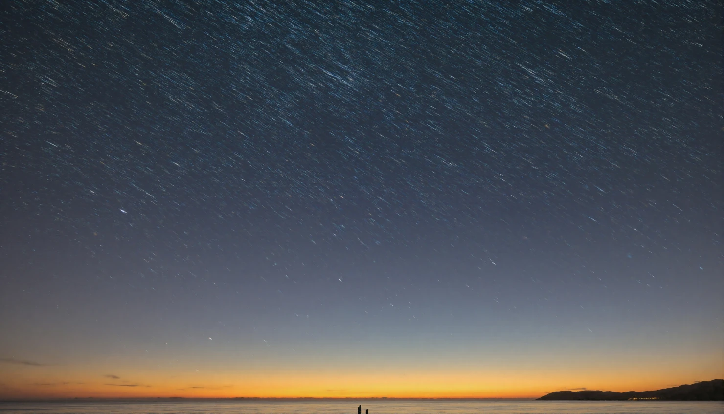 A mesmerizing long-exposure nightscape capturing swirling star trails above a calm ocean horizon at twilight, blending celestial beauty with the serene stillness of water under the deep blue sky. #40971