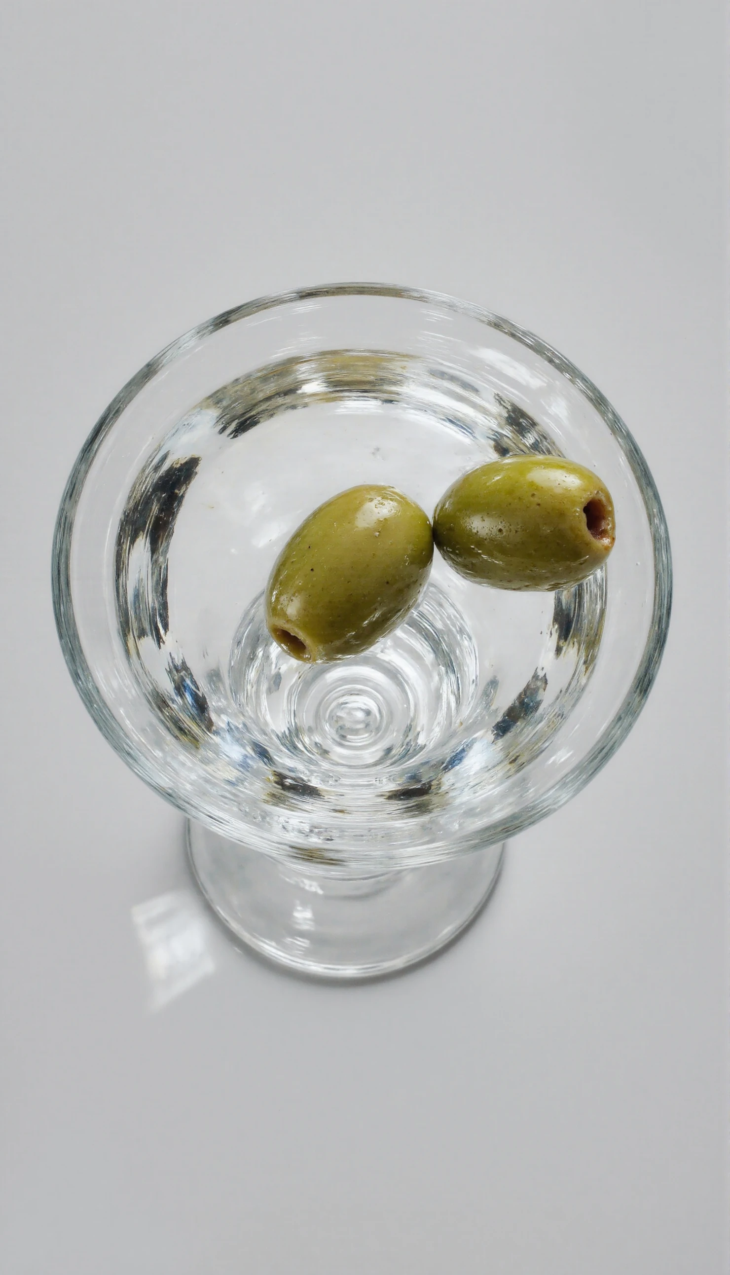 Overhead View of a Martini Glass with Two Green Olives #40995