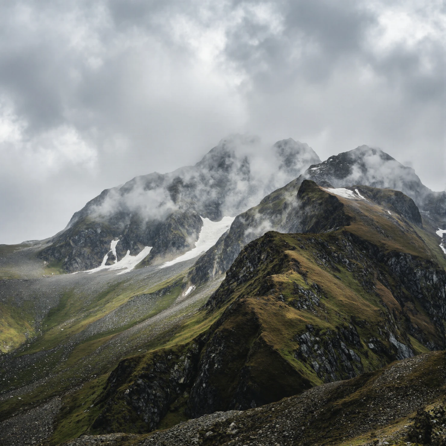 Cloud-Kissed Alpine Peaks and Rugged Slopes Under Overcast Sky #41069