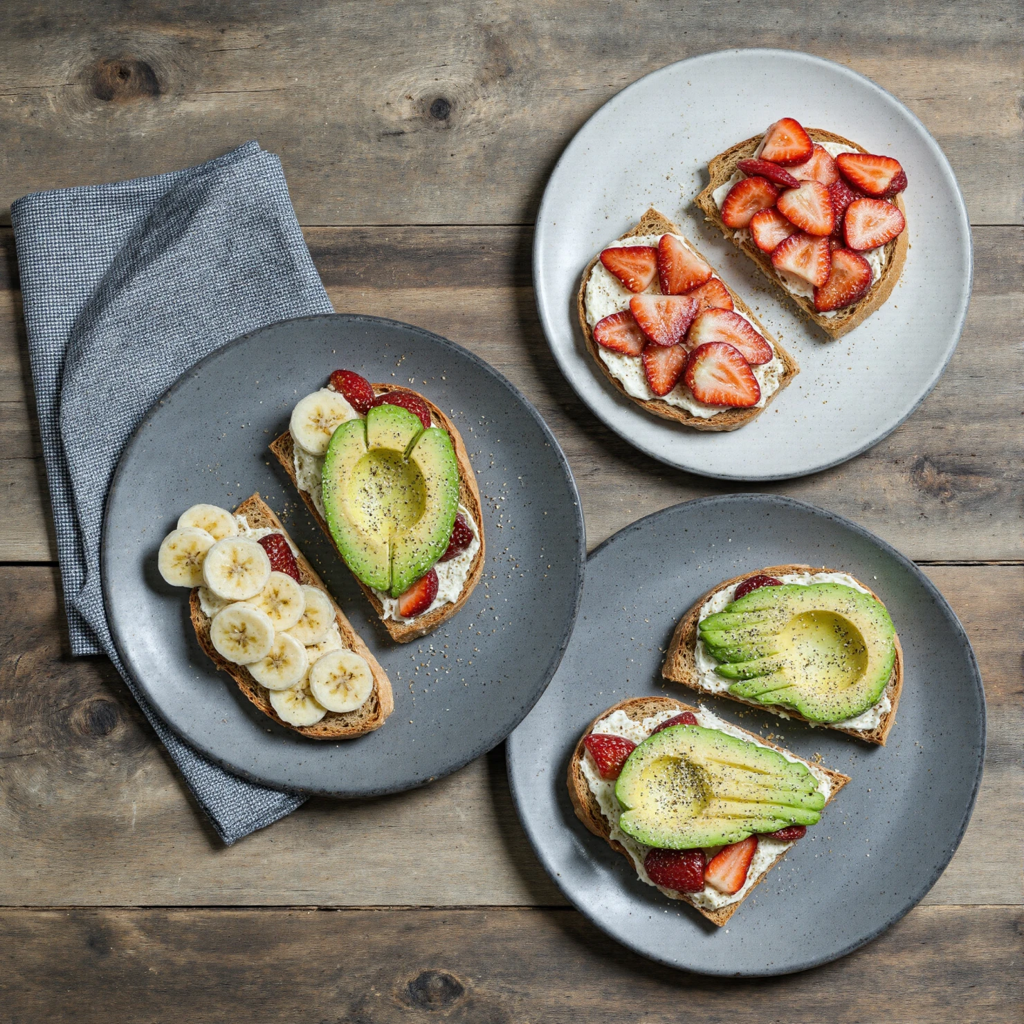 Delicious Fruit and Avocado Toasts on a Wooden Table #41123