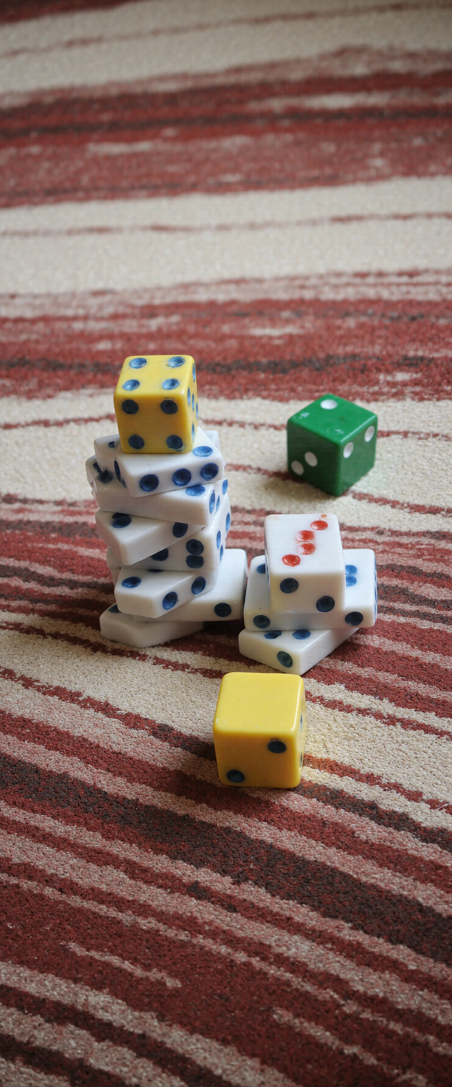 Colorful Dice Stacked on a Striped Carpet #41135
