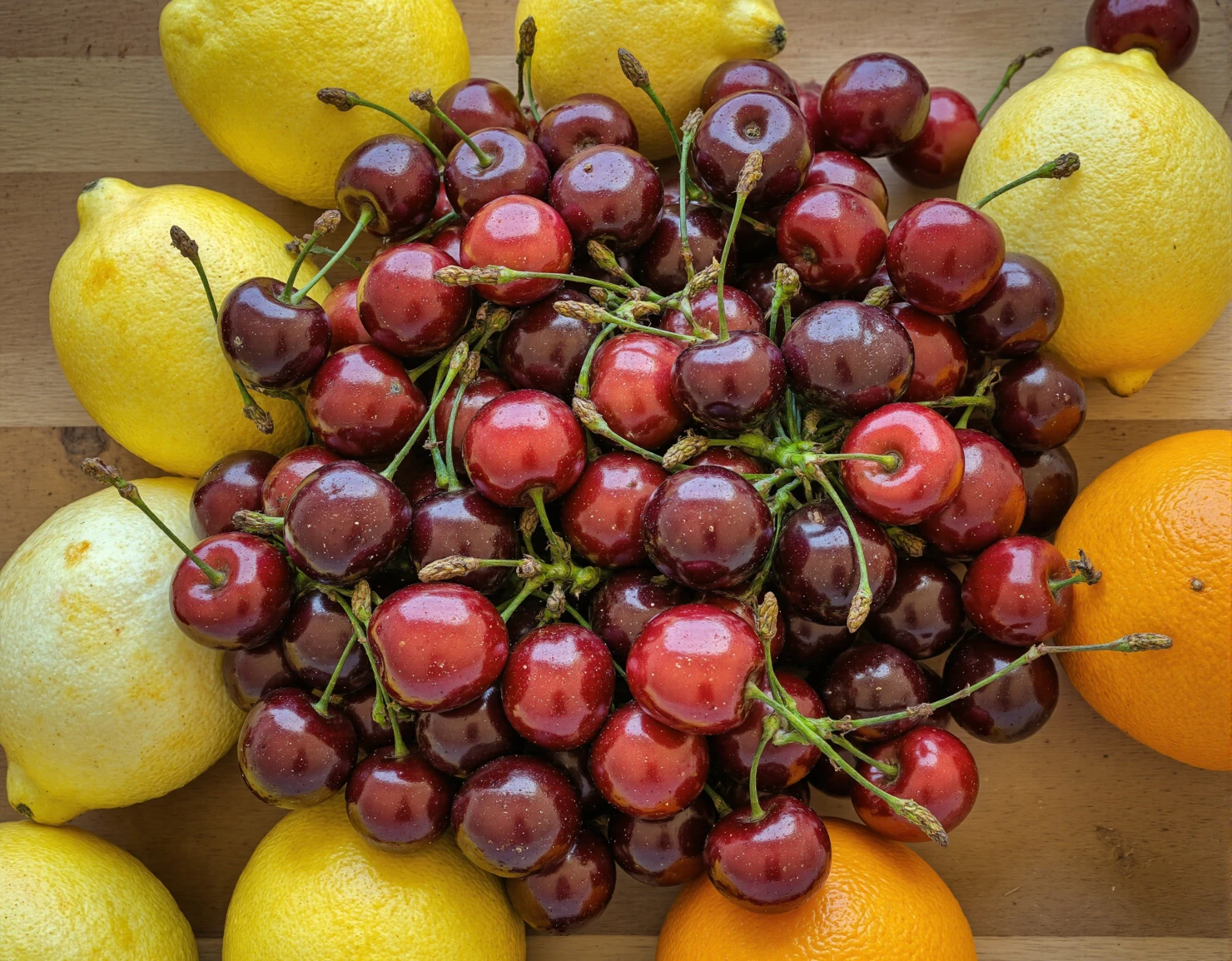 Fresh Cherries and Citrus Fruits on Wooden Board #41137