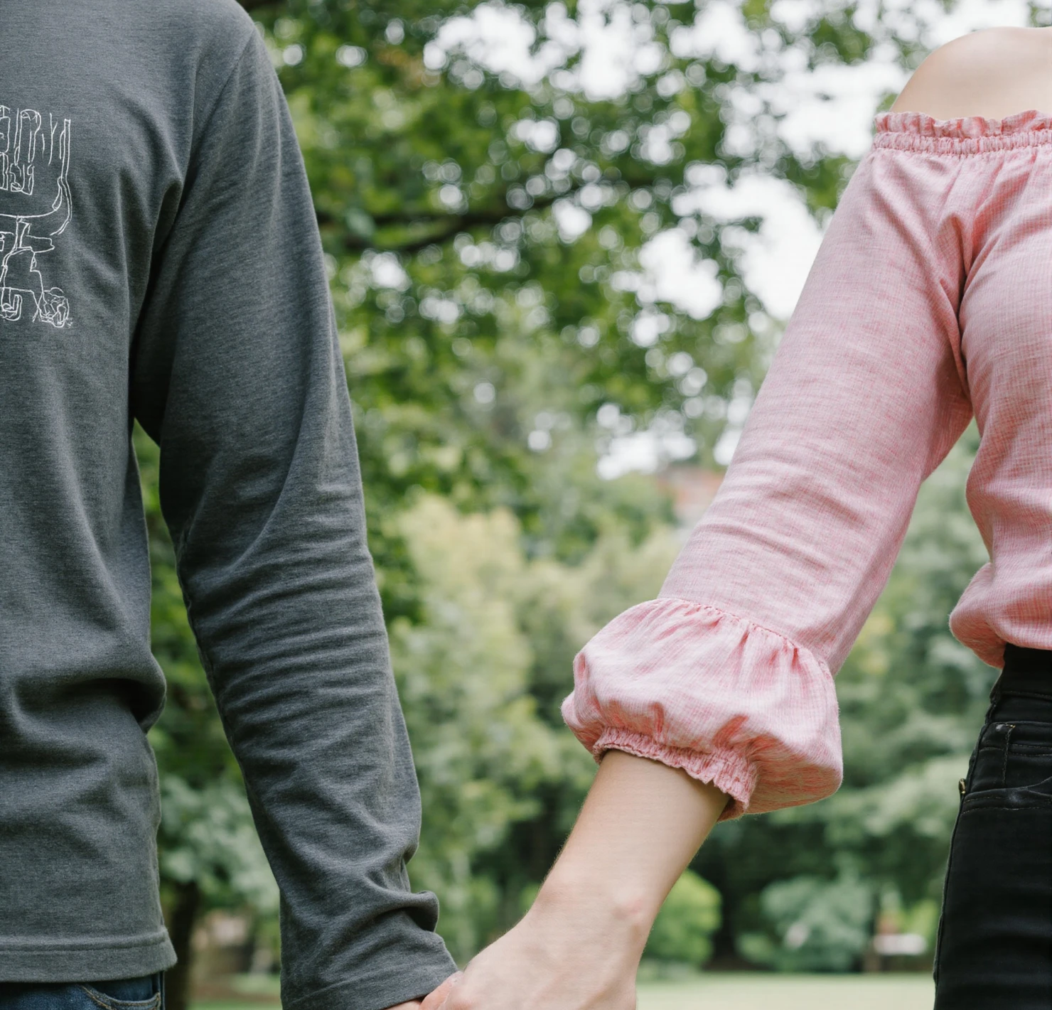 Couple Holding Hands in a Green Park #41199
