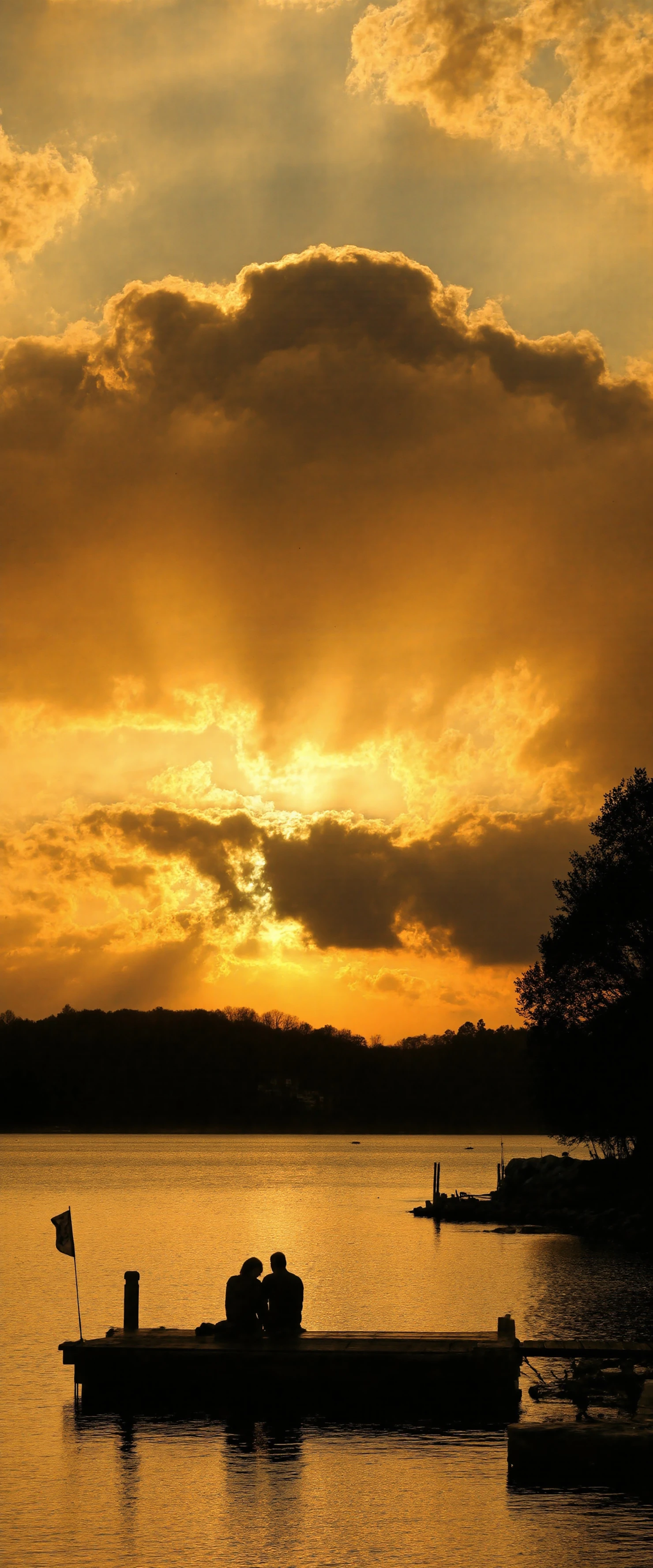 Golden Sunset Over Lake with Silhouetted Couple on Dock #41233